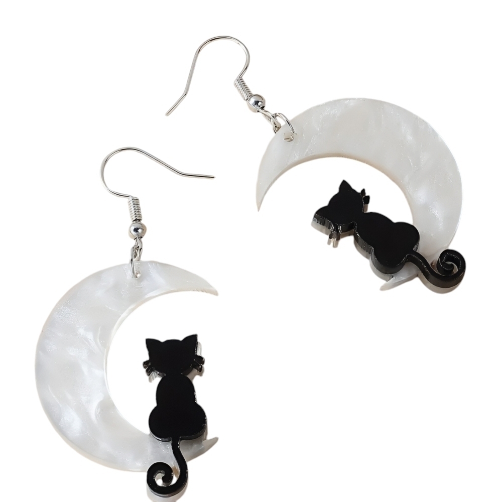 BLACK CAT SITTING ON HALF MOON PIERCED EARRINGS.